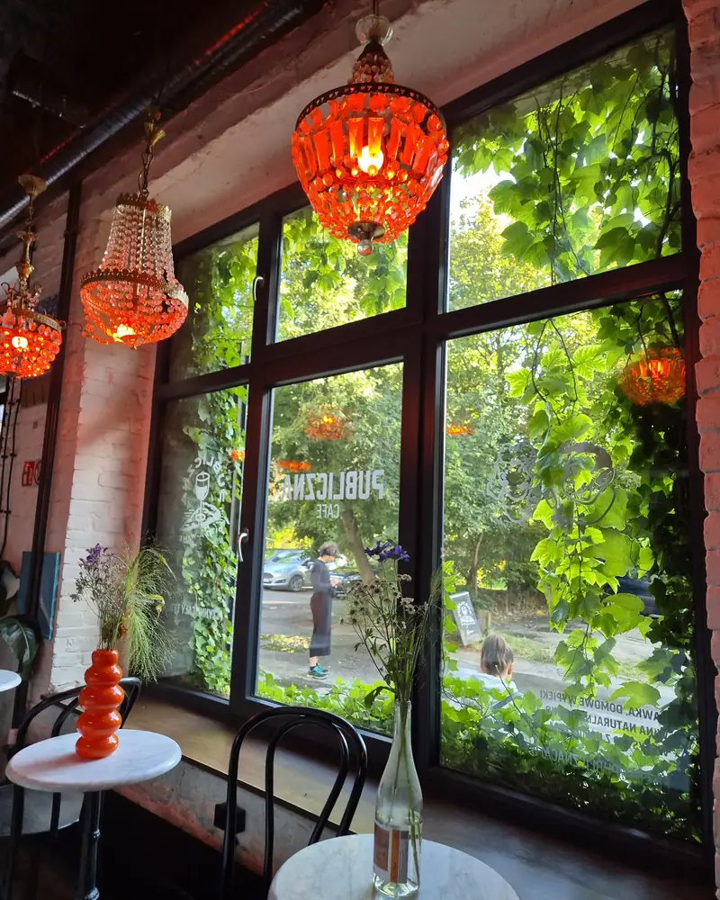 Orange lamps and ivy-covered windows