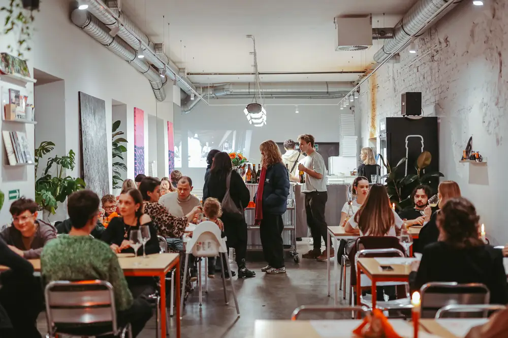 A full room at long tables